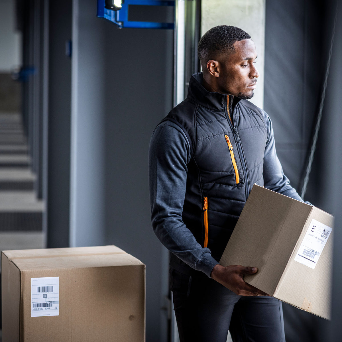 Pro Universal Bodywarmer | BLACK/ORANGE POP